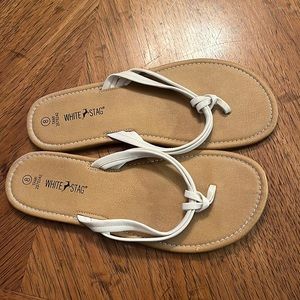 White leather flip flops. Good condition